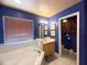 Bathroom with a soaking tub, adjacent sink vanity, neutral walls, and tiled flooring at 8557 La Isla Dr, Kissimmee, FL 34747