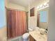 Standard bathroom featuring a shower/tub combination, a vanity with a sink, and a toilet at 8557 La Isla Dr, Kissimmee, FL 34747