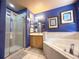 Bathroom displaying a glass enclosed shower, soaking tub, neutral tile, and bright natural light at 8557 La Isla Dr, Kissimmee, FL 34747