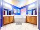 Bright bathroom with a tiled garden tub and dual sink vanities at 8557 La Isla Dr, Kissimmee, FL 34747