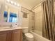 Clean bathroom with tub, shower, and updated vanity at 8557 La Isla Dr, Kissimmee, FL 34747