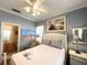 Cozy bedroom with a queen-size bed and en-suite bathroom at 8557 La Isla Dr, Kissimmee, FL 34747