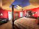 King-size bed, unique decor, and a large wardrobe at 8557 La Isla Dr, Kissimmee, FL 34747