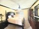 Comfortable bedroom featuring a large bed, ceiling fan, and coordinated furnishings at 8557 La Isla Dr, Kissimmee, FL 34747