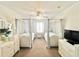 Charming bedroom with twin beds and white furniture at 8557 La Isla Dr, Kissimmee, FL 34747