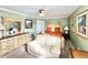 Main bedroom with a king-size bed and a sitting area at 8557 La Isla Dr, Kissimmee, FL 34747