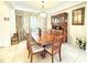 Formal dining room featuring a large table, a wooden cabinet and a decorative hutch at 8557 La Isla Dr, Kissimmee, FL 34747