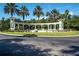Welcoming Emerald Island Resort entrance with water feature and palm trees at 8557 La Isla Dr, Kissimmee, FL 34747