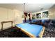 Game room features pool table, pinball machines, and arcade game at 8557 La Isla Dr, Kissimmee, FL 34747