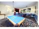Entertaining game room featuring a pool table and comfortable seating area at 8557 La Isla Dr, Kissimmee, FL 34747