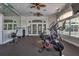 Well-equipped gym featuring modern exercise equipment, mirrored walls, and ceiling fans at 8557 La Isla Dr, Kissimmee, FL 34747