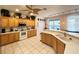 Bright kitchen with wood cabinets and stainless steel appliances at 8557 La Isla Dr, Kissimmee, FL 34747