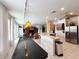 Spacious kitchen boasts granite countertops, stainless steel appliances, and an island at 8557 La Isla Dr, Kissimmee, FL 34747