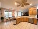 Bright kitchen with wood cabinets and stainless steel appliances at 8557 La Isla Dr, Kissimmee, FL 34747