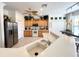Bright kitchen with wood cabinets and stainless steel appliances at 8557 La Isla Dr, Kissimmee, FL 34747