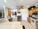 Bright kitchen with wood cabinets and stainless steel appliances at 8557 La Isla Dr, Kissimmee, FL 34747