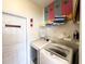 Laundry room with washer, dryer, and shelving at 8557 La Isla Dr, Kissimmee, FL 34747