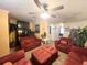Comfortable living room with red couches and a large TV at 8557 La Isla Dr, Kissimmee, FL 34747