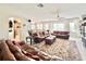 Spacious living room with leather sofas and pool view at 8557 La Isla Dr, Kissimmee, FL 34747