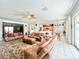 Spacious living room with leather sofas and large area rug at 8557 La Isla Dr, Kissimmee, FL 34747