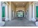 Community lobby featuring tile flooring with the resort logo, tall columns, and glass entry doors at 8557 La Isla Dr, Kissimmee, FL 34747