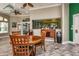 Cozy lounge area with tables, chairs, and a bar area, ideal for socializing and relaxation at 8557 La Isla Dr, Kissimmee, FL 34747