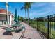 Charming patio with picnic tables and views of the pond at 8557 La Isla Dr, Kissimmee, FL 34747