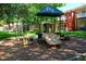 The community playground features a slide, swings and more, fun for children and families at 8557 La Isla Dr, Kissimmee, FL 34747