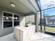 Outdoor kitchen with grill, adjacent to screened pool area at 8557 La Isla Dr, Kissimmee, FL 34747