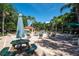 Lounge by the beautiful community pool area, surrounded by lush landscaping and comfortable seating at 8557 La Isla Dr, Kissimmee, FL 34747