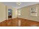 Spacious bedroom with hardwood floors and ensuite bathroom access at 8737 Leeland Archer Blvd, Orlando, FL 32836
