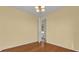 Bright bedroom with hardwood floors and access to backyard at 8737 Leeland Archer Blvd, Orlando, FL 32836