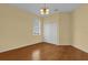Well-lit bedroom featuring hardwood floors and a double door closet at 8737 Leeland Archer Blvd, Orlando, FL 32836
