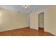 Bright bedroom with hardwood floors and walk-in closet at 8737 Leeland Archer Blvd, Orlando, FL 32836