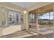 Bright breakfast nook with built-in seating and access to a screened patio at 8737 Leeland Archer Blvd, Orlando, FL 32836