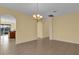 Dining room with tile floors, an arched entryway, and a chandelier at 8737 Leeland Archer Blvd, Orlando, FL 32836