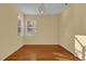Formal dining room with hardwood floors and large window at 8737 Leeland Archer Blvd, Orlando, FL 32836