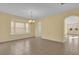 Spacious dining room featuring tile floors and an arched doorway at 8737 Leeland Archer Blvd, Orlando, FL 32836
