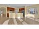 Kitchen with island, stainless steel appliances, and wood cabinets at 8737 Leeland Archer Blvd, Orlando, FL 32836