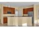 Kitchen with granite countertops and wood cabinets at 8737 Leeland Archer Blvd, Orlando, FL 32836