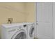 Well-lit laundry room, featuring LG washer and dryer, and ample shelving at 8737 Leeland Archer Blvd, Orlando, FL 32836