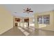 Bright and airy living room with tile floors and kitchen views at 8737 Leeland Archer Blvd, Orlando, FL 32836