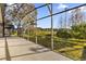 Extended screened patio with scenic views and plenty of space for relaxation at 8737 Leeland Archer Blvd, Orlando, FL 32836