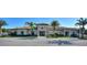 Community clubhouse with palm trees and ample parking at 8899 Fallen Oak Dr, Davenport, FL 33836