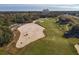Aerial view of a golf course and residential area at 904 Assembly Ct, Reunion, FL 34747
