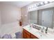 Bathroom boasts double sinks, a soaking tub and a separate shower at 904 Assembly Ct, Reunion, FL 34747