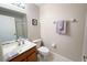 Small bathroom with a sink and toilet at 904 Assembly Ct, Reunion, FL 34747