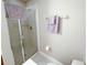 Clean bathroom with a shower and toilet at 904 Assembly Ct, Reunion, FL 34747