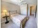 Bright bedroom with double bed, nightstand, and ample closet space at 904 Assembly Ct, Reunion, FL 34747