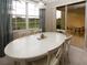 Bright dining room with white table and access to a patio at 904 Assembly Ct, Reunion, FL 34747